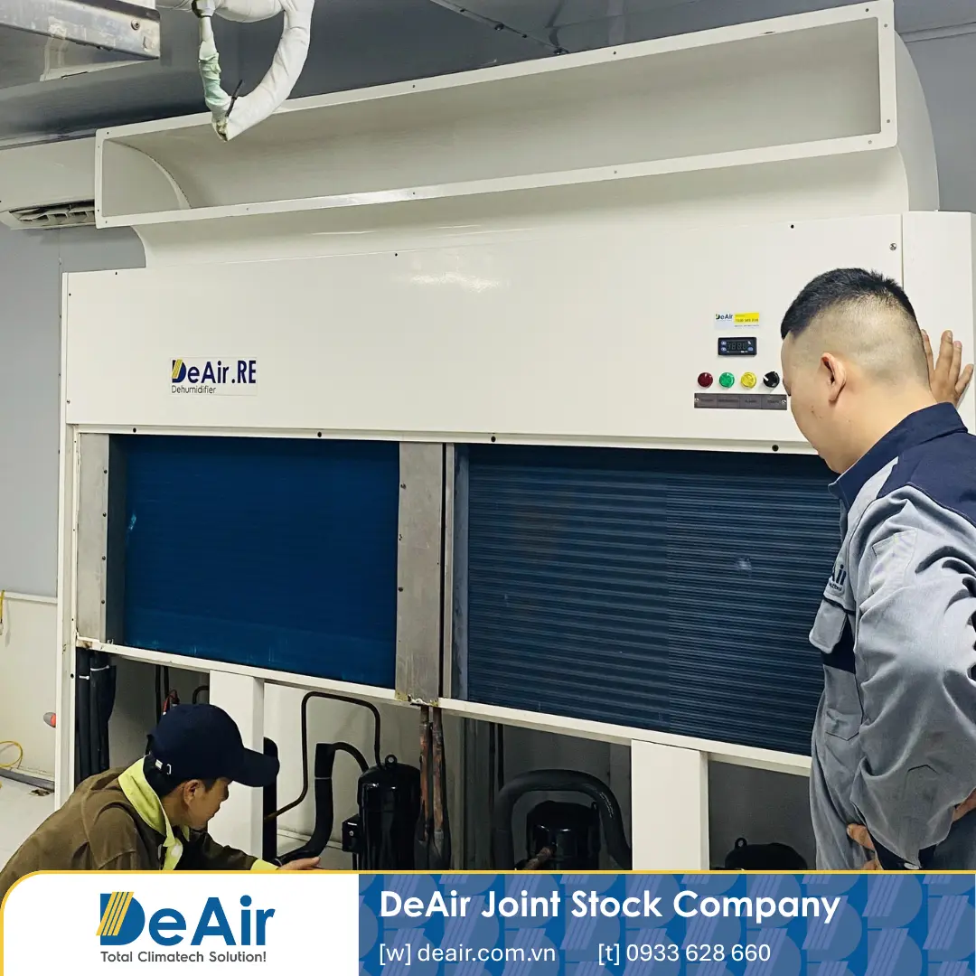 DeAir technician measuring refrigerant gas pressures and compressor metrics