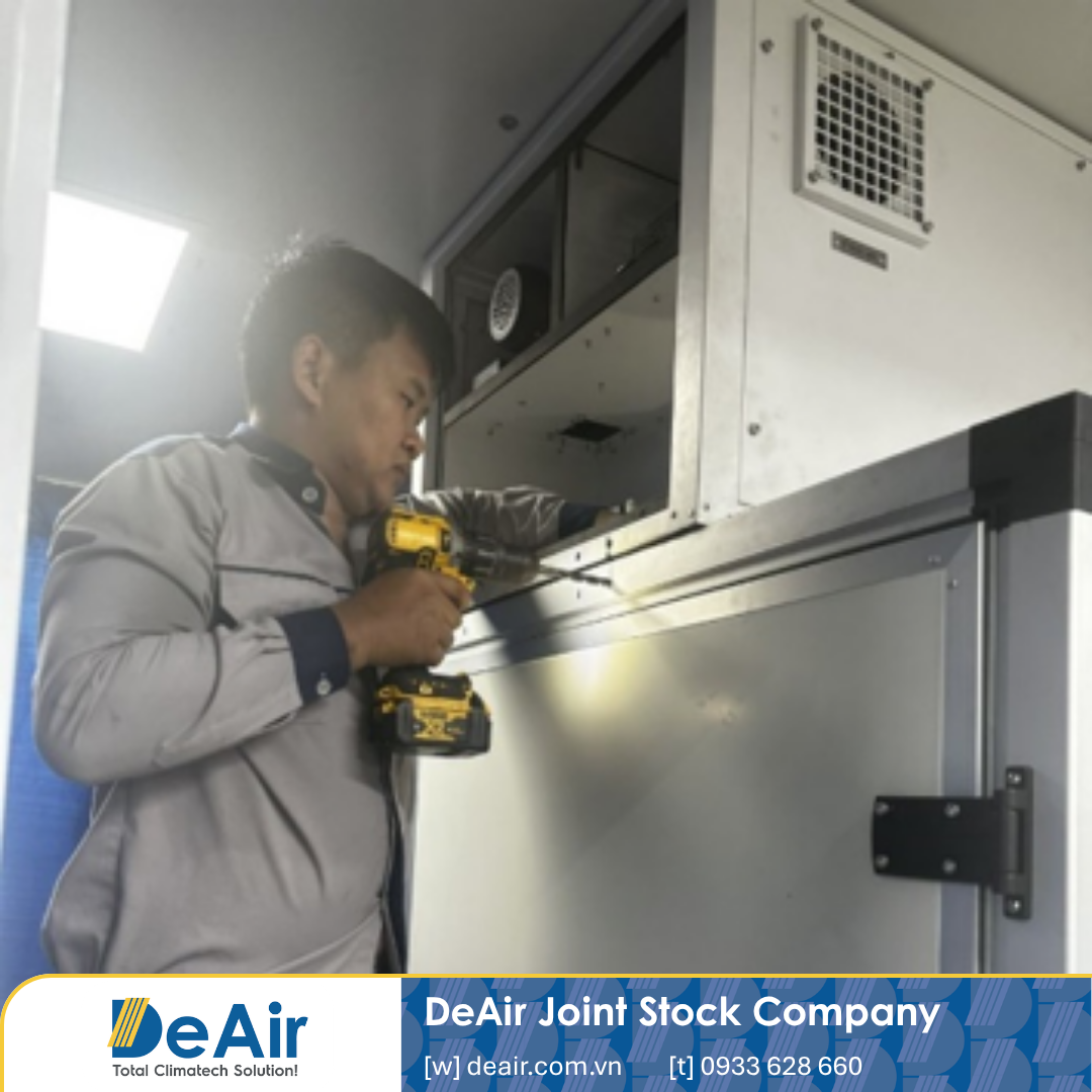 DeAir technicians performing periodic maintenance on a rotor dehumidifier