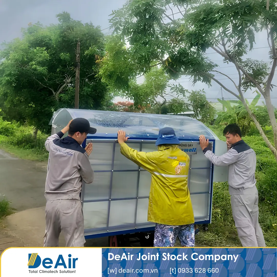 DeAir technicians transporting the drying room