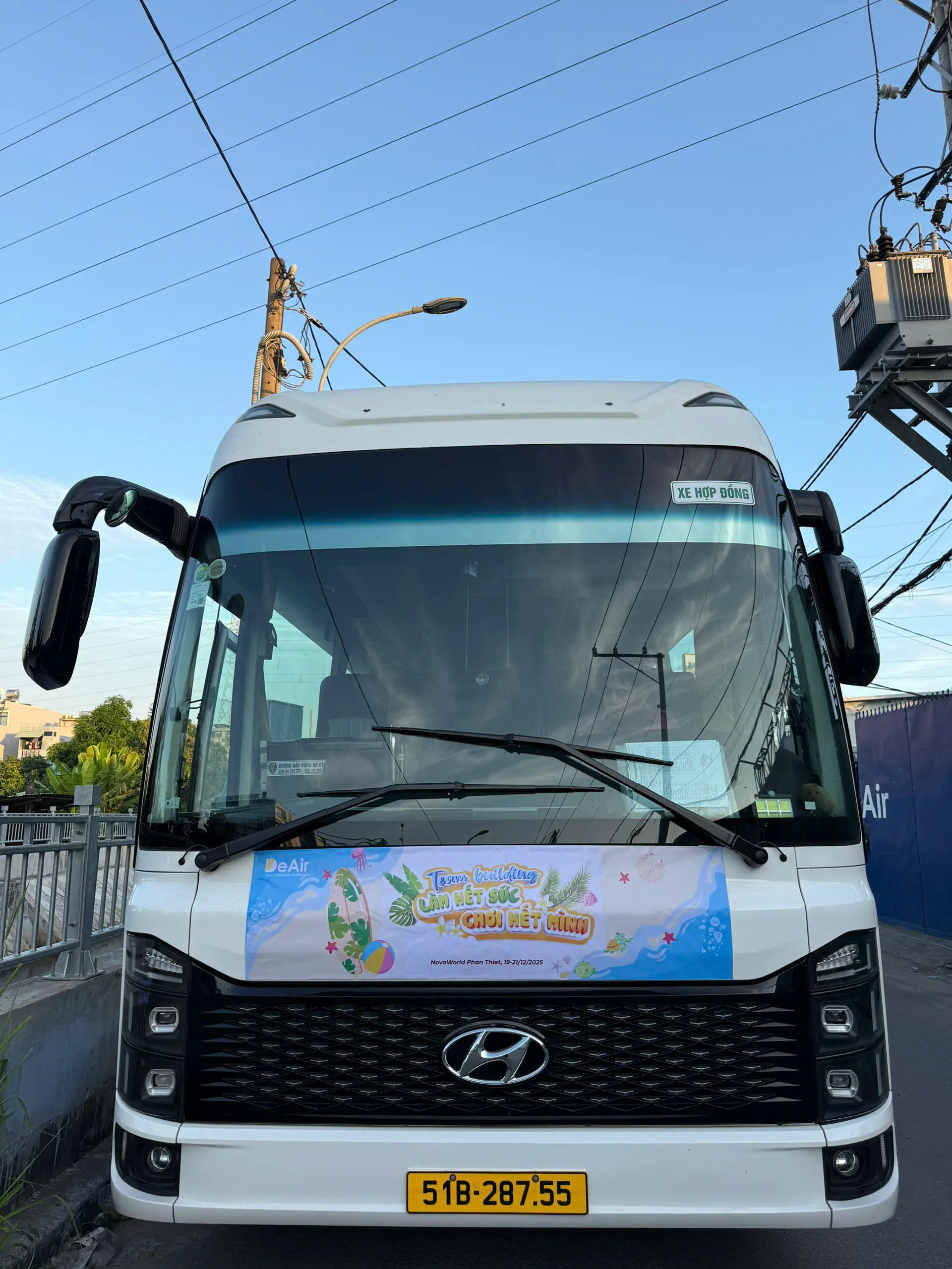 Bright smiles of members on the bonding trip bus.