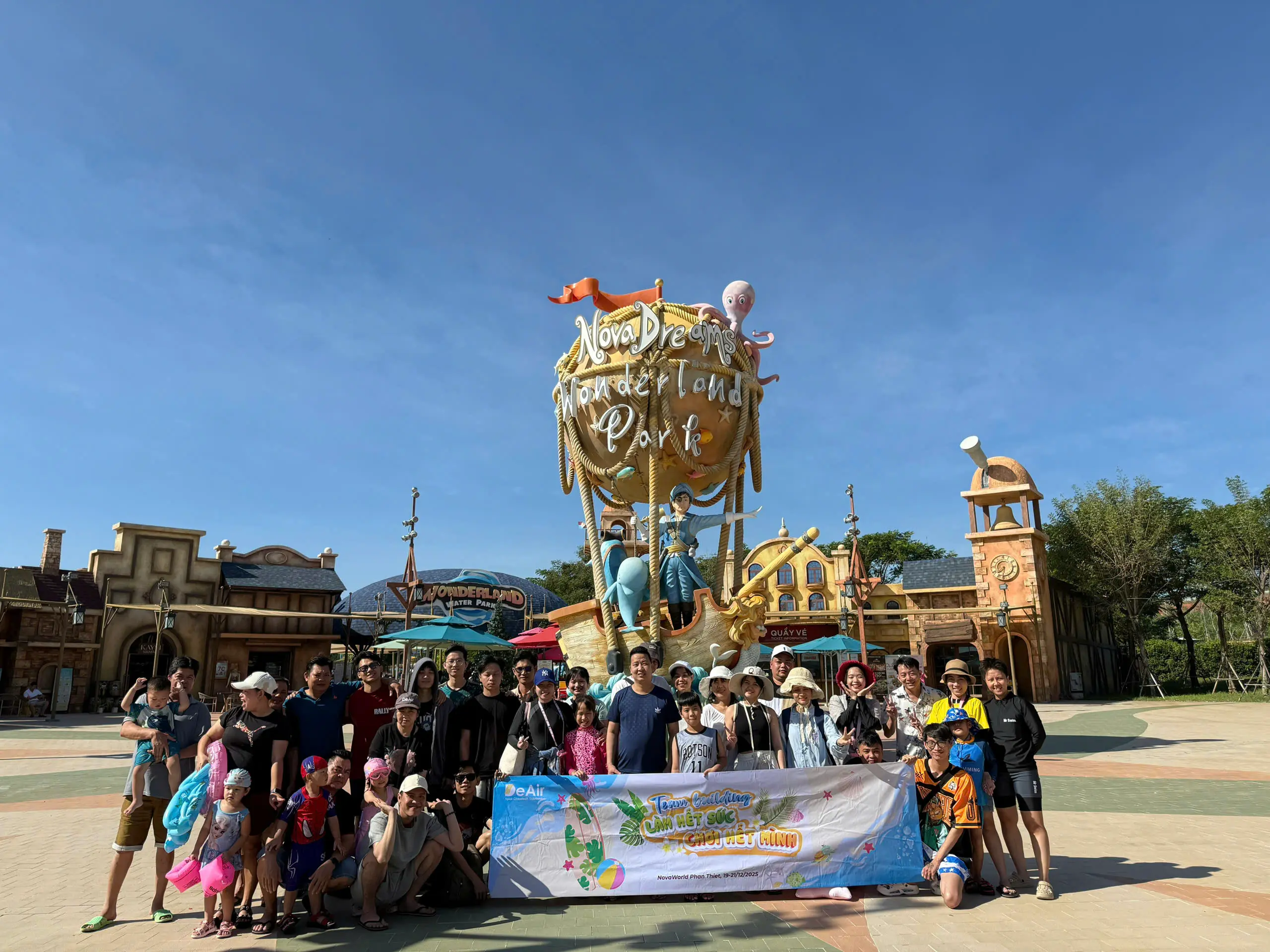 DeAir team excitedly participating in water games.